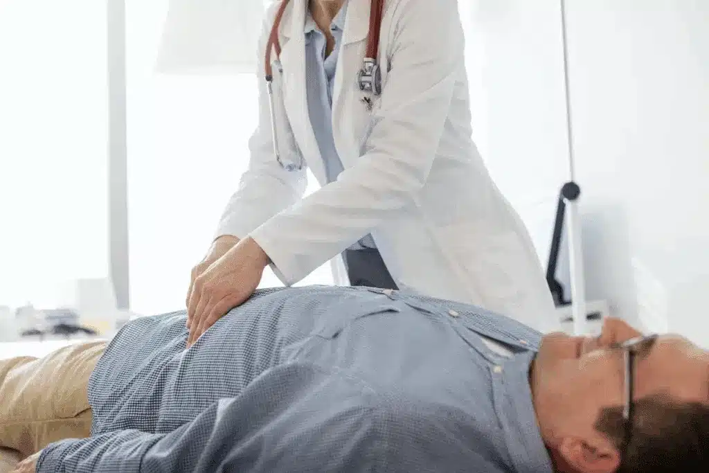 Medical professional in a white coat performing CPR on a patient lying on their back.